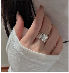 Detail of wide S925 sterling silver ring featuring irregular hammered vintage texture