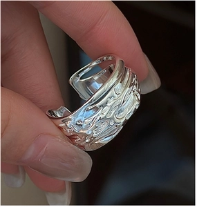 Detailed macro view of S925 sterling silver ring with irregular lava texture finish