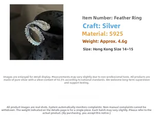 Detail view of S925 sterling silver feather ring with textured engraving and open design