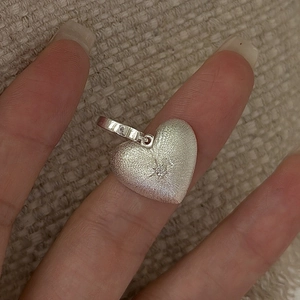 Matte finish S925 sterling silver heart pendant with starburst engraving and tiny crystal