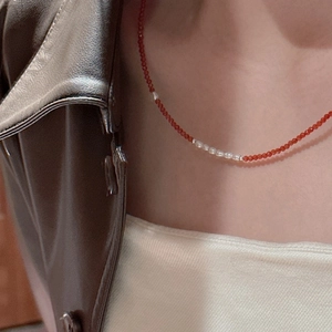 Elegant S925 sterling silver necklace with red spinel beads and white pearls on a model