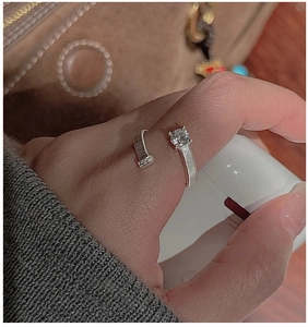 Detailed view of S925 silver nail ring featuring textured finish and sparkling zircon stones