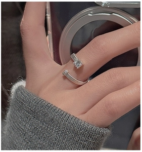 Detail of S925 silver nail ring featuring textured band and sparkling round zircon stone