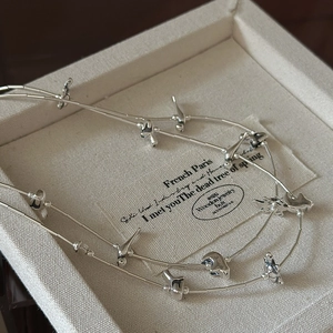 Vintage S925 sterling silver necklace featuring multiple flying bird pendants on a tube chain