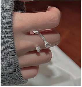 Macro detail of S925 sterling silver ring showing hand-wrapped texture and square zircon