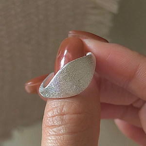 Minimalist S925 sterling silver ring with a vintage brushed finish and asymmetric design