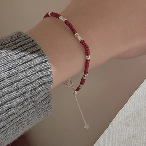 Red woven rope bracelet with S925 silver tube beads and a delicate heart pendant