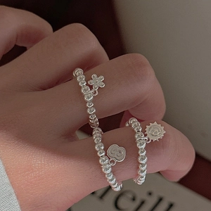 S925 sterling silver beaded rings with CD pendants and floral charms on hand
