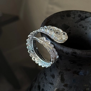 S925 sterling silver feather ring with cubic zirconia in a vintage adjustable open design