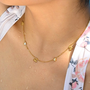 Golden stainless steel necklace featuring cherry and white crystal heart pendant for women