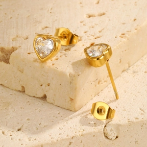 18K gold plated heart stud earrings with white zircon on natural stone background