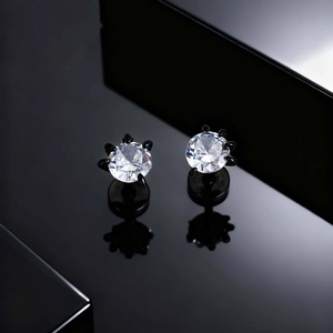 Macro view of black dragon claw studs with large round white cubic zirconia stones