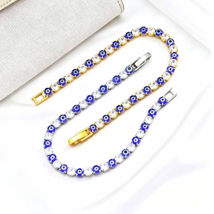 Close-up of gold and silver plated evil eye tennis bracelets with sparkling zircons
