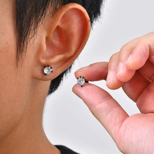 Minimalist black stainless steel ear studs with round white zircon in a six-prong setting