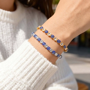 Detail view of Evil Eye beaded bracelets with crystals on a wrist in natural light