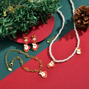 Christmas jewelry set with Santa Claus pendants, pearl necklace and gold earrings
