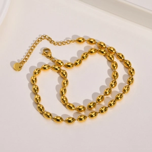 Gepolijste gouden ovale kralenketting met kreeftsluiting en verlengketting detail