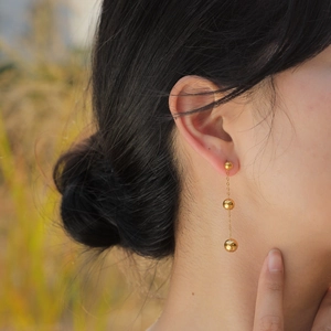 Elegant gold stainless steel drop earrings with long tassel and three round metal beads