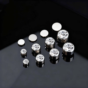 Set of five silver clip-on earrings with clear cubic zirconia in graduated sizes