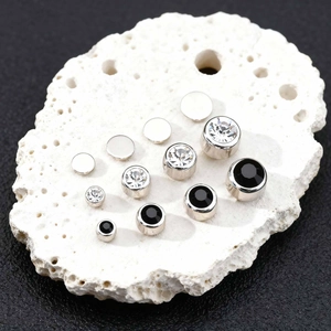 Macro view of magnetic non-piercing earrings with black and clear crystals