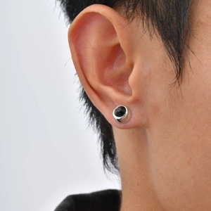 Minimalist silver men's ear clip featuring a faceted black zircon stone in a circular design