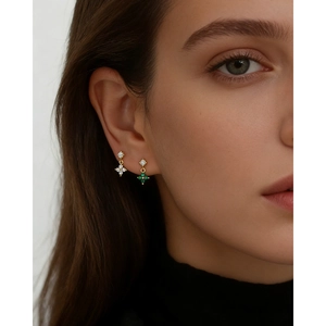 Asymmetric S925 silver four-leaf clover stud earrings with cubic zirconia stones