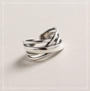 Detailed view of layered irregular winding design on a 925 sterling silver ring