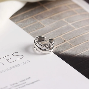 Detailed view of irregular multilayer winding S925 silver adjustable ring on magazine