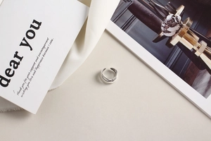 Close-up of a multilayer irregular S925 sterling silver ring with a minimalist woven design