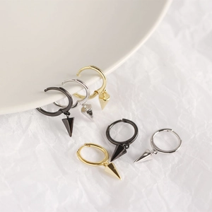Detailed view of punk style S925 silver hoop earrings with cone charms in three colors
