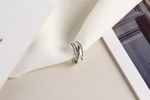 Detailed close-up of an irregular multi-layered S925 sterling silver winding ring