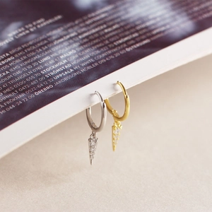 Macro shot of S925 sterling silver spike hoop earrings with micro-set zircon stones