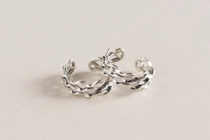 Detailed macro view of retro wavy layered S925 sterling silver open rings for women