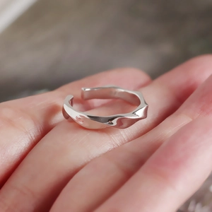 Minimalist S925 sterling silver twisted wave open ring worn on a finger