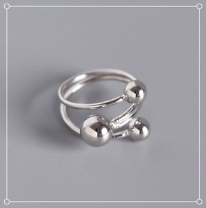 Detail view of S925 sterling silver double-layered open ring with three polished beads