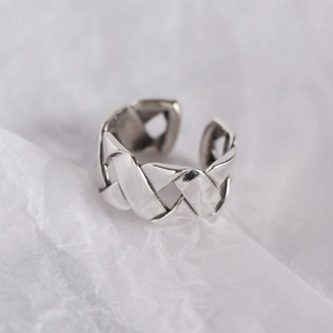 Vintage S925 sterling silver wide woven ring with oxidized finish on white background