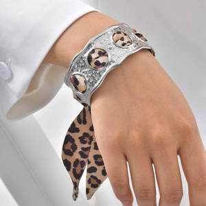 Adjustable silver cuff bracelet featuring leopard print silk scarf ribbon decoration