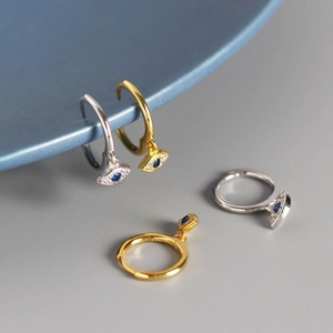 Boucles d'oreilles œil protecteur en argent S925 avec pierres bleues et finitions or