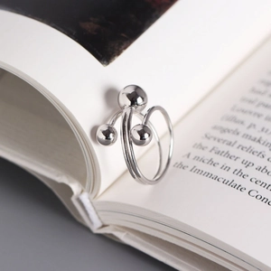 Minimalist S925 sterling silver open ring featuring three polished beads on a spiral band