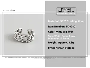 Macro detail of S925 sterling silver double-layered chain and rope textured ring