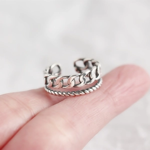 Macro detail of S925 sterling silver double layer chain ring with vintage oxidized finish