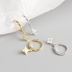 Close-up of S925 sterling silver star drop earrings with sparkling cubic zirconia inlay