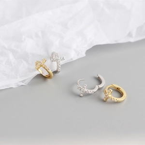 Detailed close-up of S925 silver hoop earrings with zircon-set cross in gold and silver