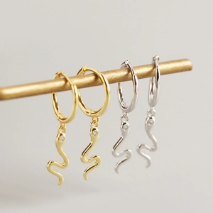 Elegant gold and silver snake drop hoop earrings with sparkling zircon accents
