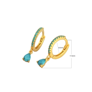 Detail view of gold hoop earrings with turquoise stones and waterdrop pendants