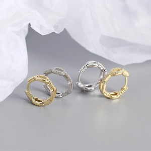 Detailed close-up of S925 sterling silver chain link hoop earrings with cubic zirconia stones
