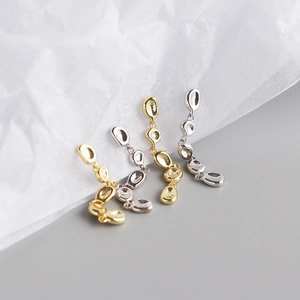 Irregular pebble-shaped tassel earrings in polished gold and silver S925 sterling silver