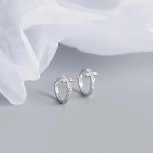 Detailed view of silver S925 cross hoop earrings with sparkling zircon stones