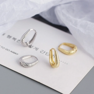 U-shaped S925 sterling silver hoop earrings with textured twist pattern in gold and silver