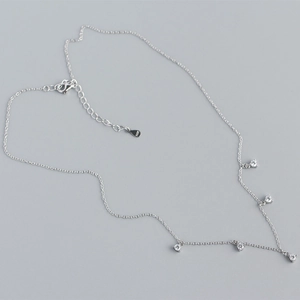 Close-up of S925 silver necklace with five cubic zirconia pendants and lobster clasp